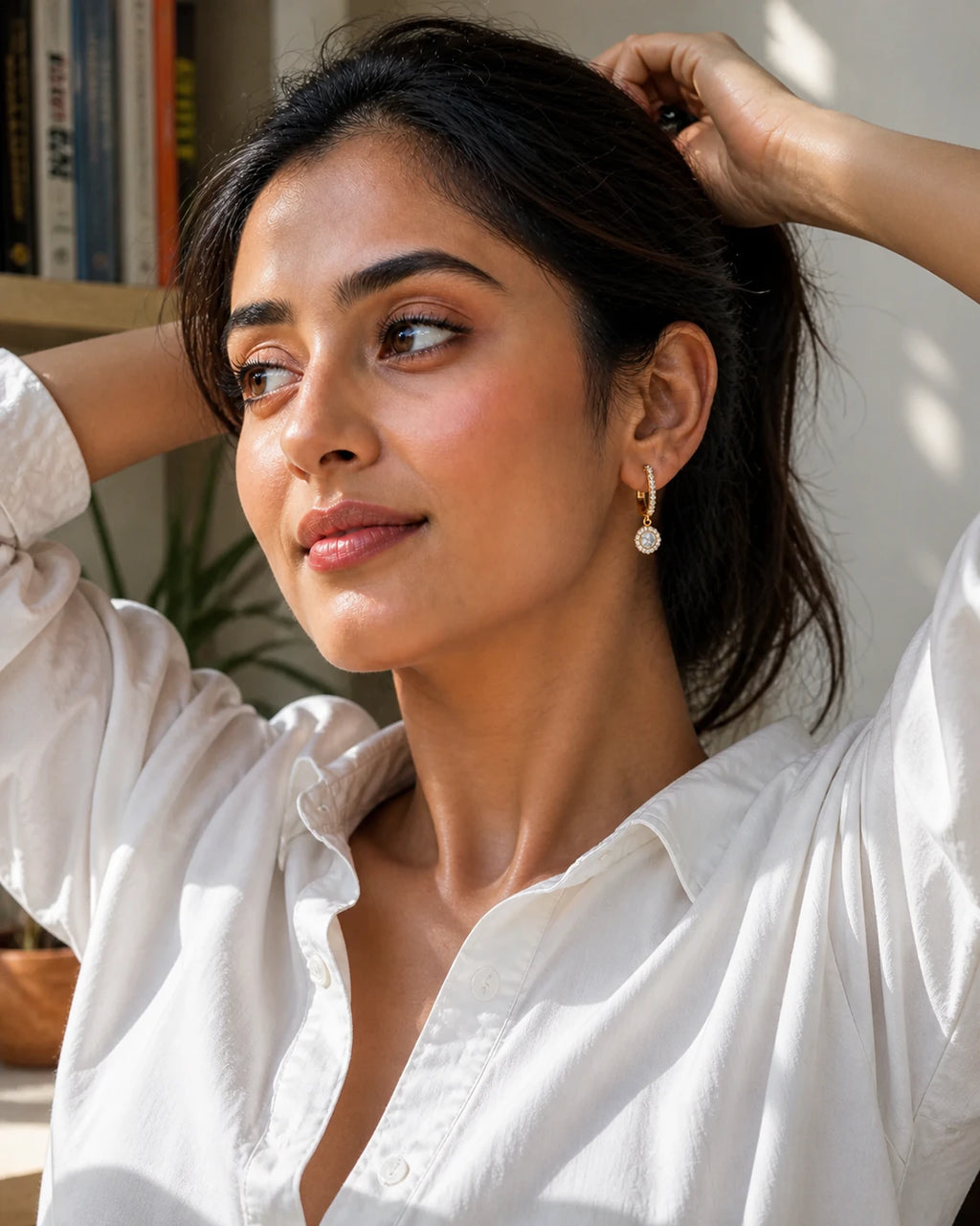 Celeste Drop Earrings in an ARYAMOND editorial image