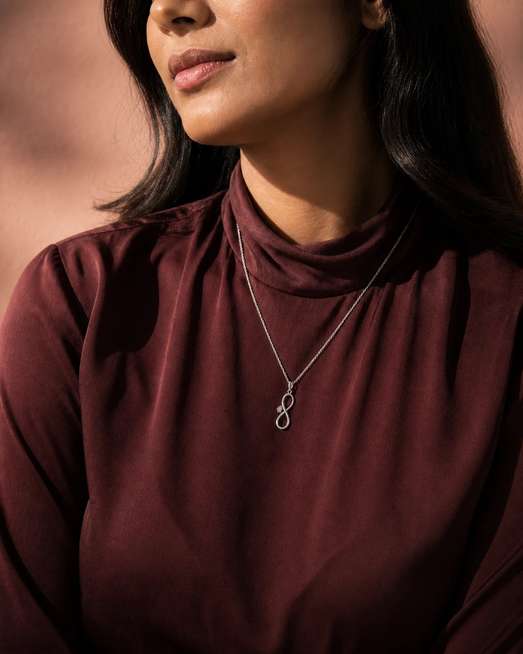 Infinity Solitaire Pendant in an ARYAMOND editorial image