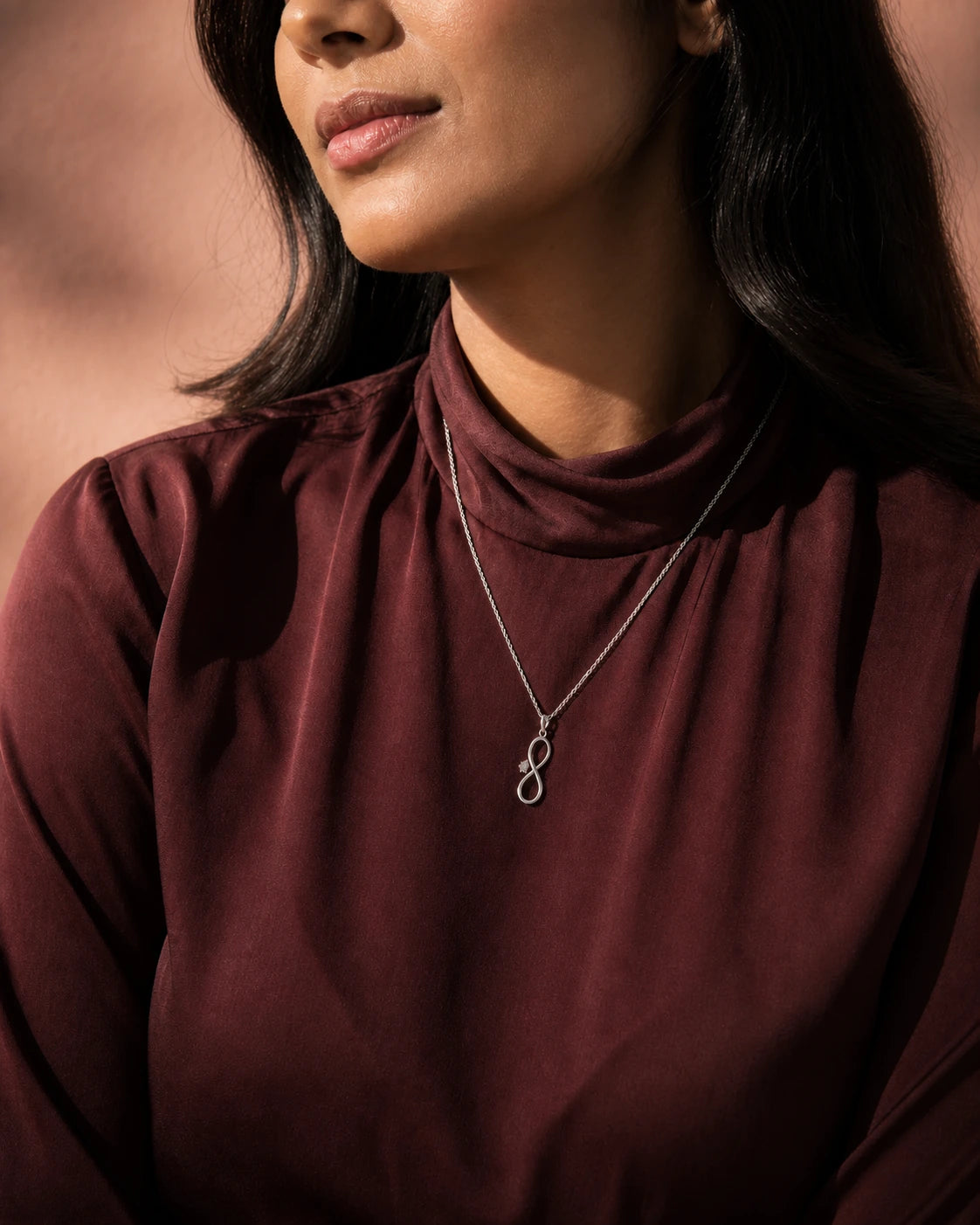 Infinity Solitaire Pendant in an ARYAMOND editorial image